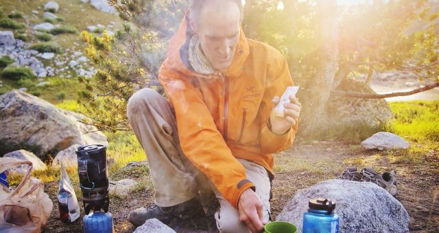 Dinner preparation. The smoke helps keep mosquitoes at bay.