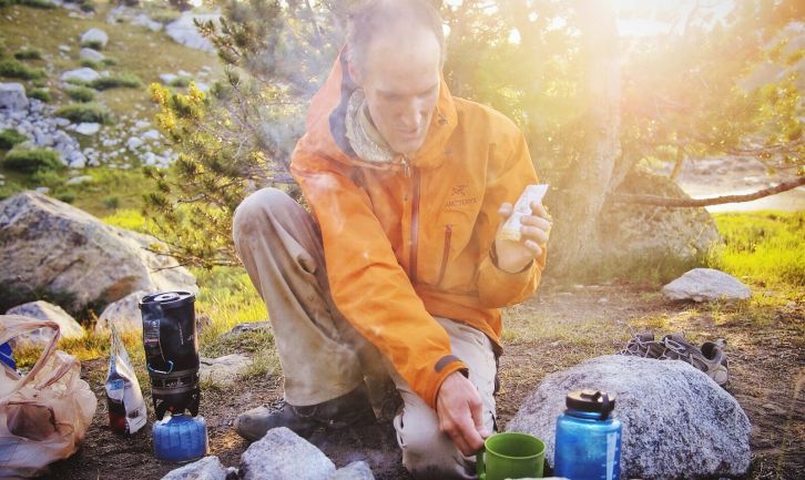 Dinner preparation. The smoke helps keep mosquitoes at bay.