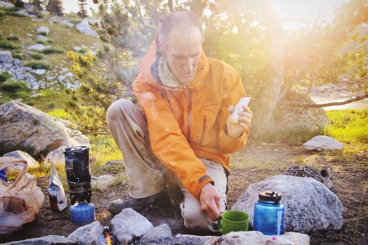 Dinner preparation. The smoke helps keep mosquitoes at bay.